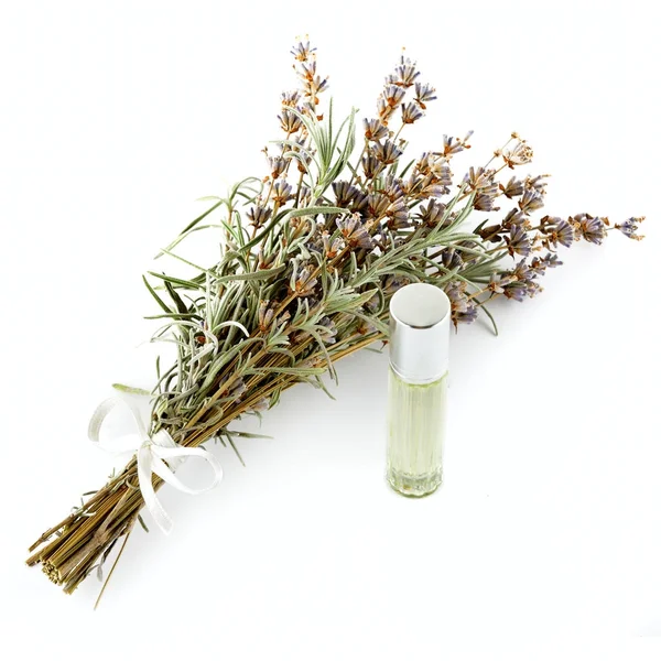 Flowers and lavender oil isolated on white — Stock Photo, Image