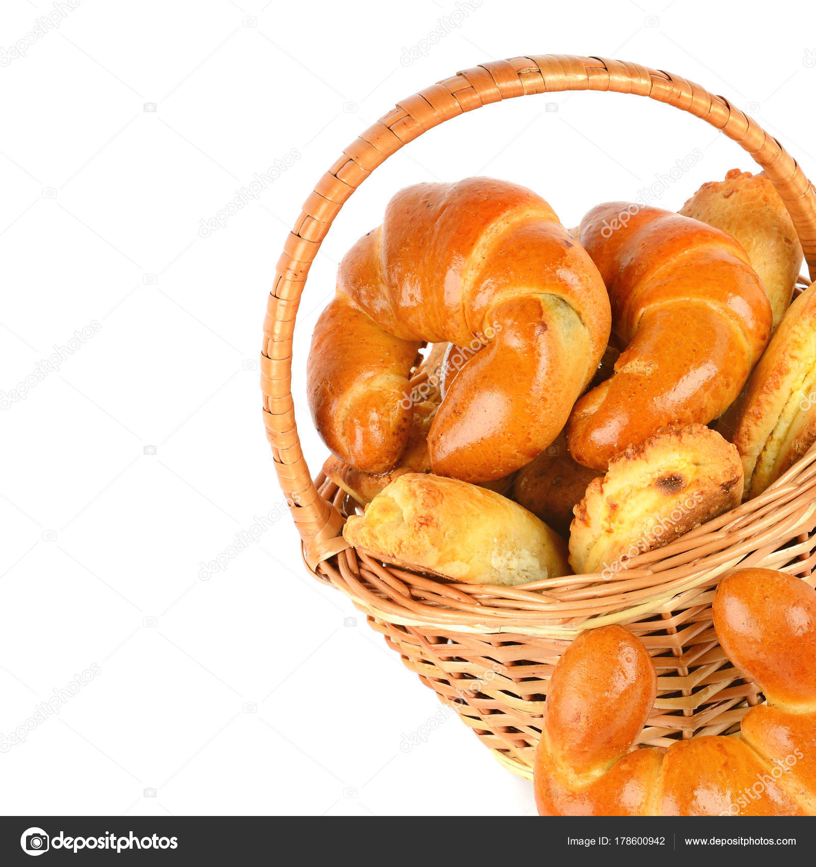 Croissants And Cottage Cheese Rolls In Wicker Basket Isolated On
