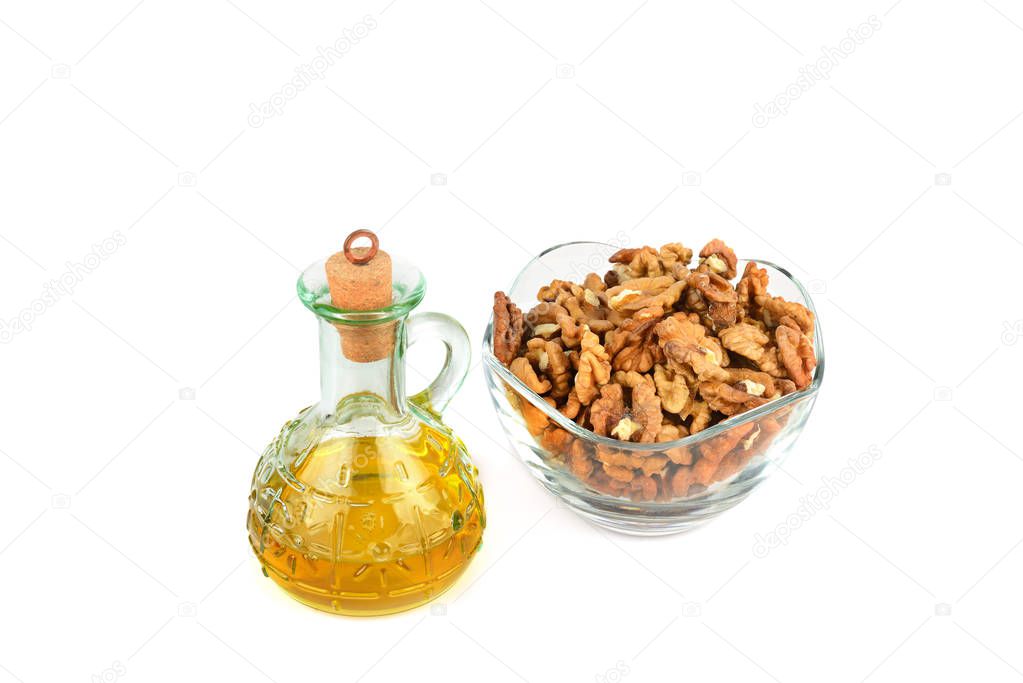 Oil of walnut and nut fruit isolated on white background.