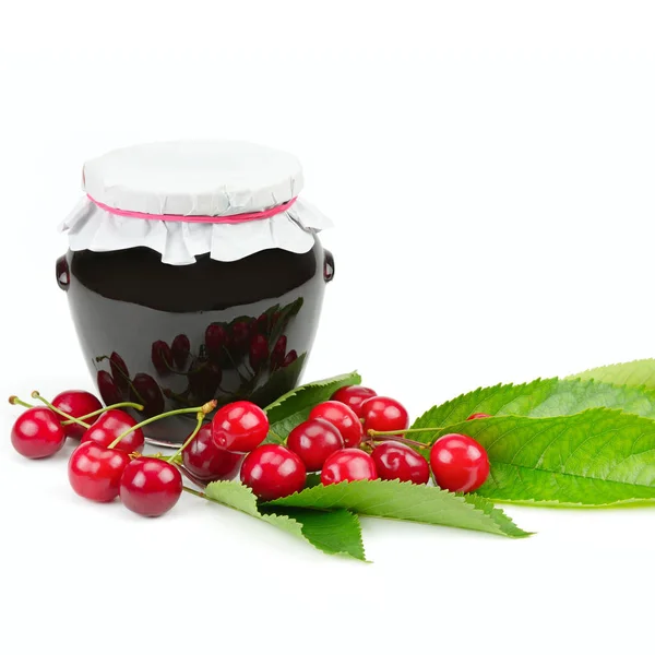 Cherries and jars of jam isolated on a white background. — Stock Photo, Image