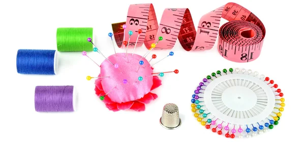 Composition with threads and sewing accessories isolated on whit — Stock Photo, Image