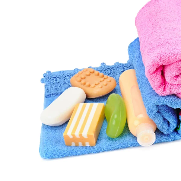 Cotton towels, cosmetic soap and shampoo isolated on white backg — Stock Photo, Image