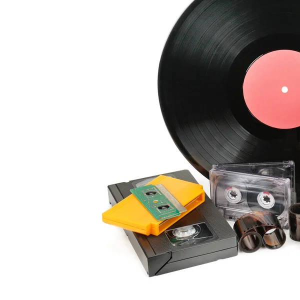 Vinyl record, video and audio cassettes isolated on white backgr — Stock Photo, Image