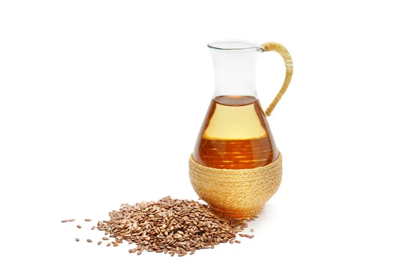 Flax seeds with oil over white background. — Stock Photo, Image