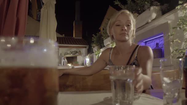 Young Woman Sitting Terrace Restaurant Drinking Water Summer Vacation Evening — Stock Video