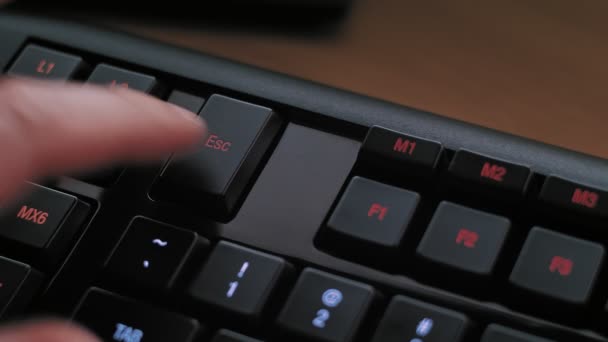 Man Pressing Escape Key Modern Illuminated Computer Keyboard — Stock Video