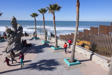 Tijuana beach park at the border clipart