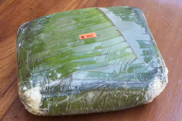 Traditional Mexican cheese in banana leaf — Stock Photo, Image