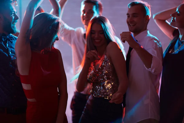 Cheerful friends dancing at disco party — Stock Photo, Image