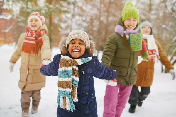 Happy girl holding her friends by hands — ストック写真