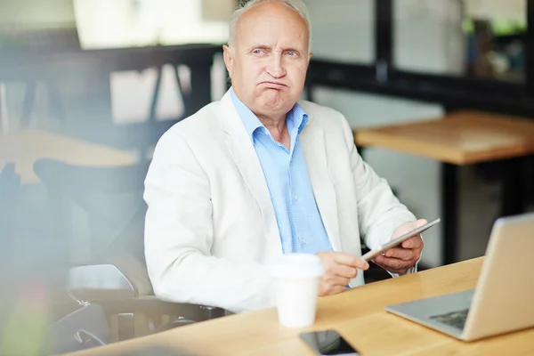 Senior businessman in cafe — Stock Photo, Image