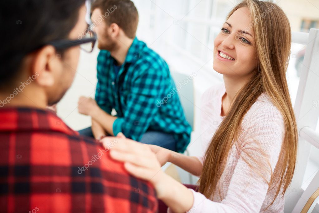 Young woman supporting stressed man 