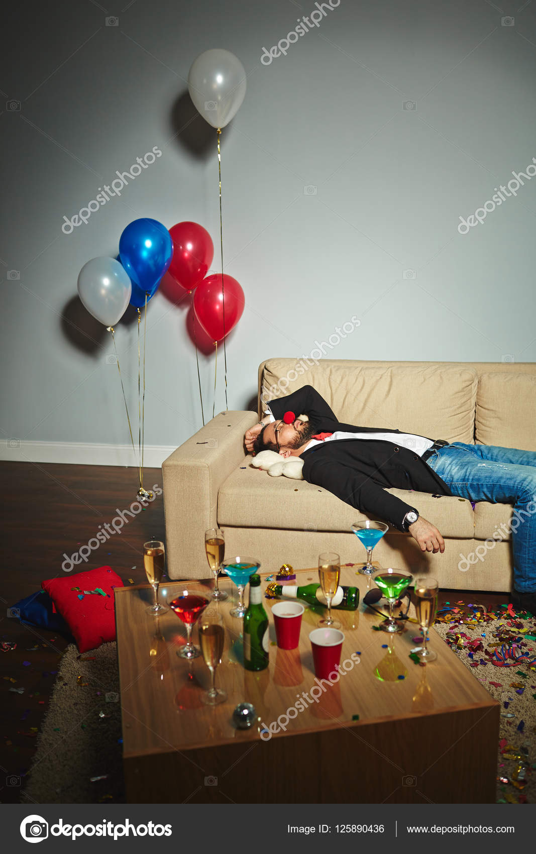 Drunk man sleeping after party Stock Photo by ©pressmaster 125890436