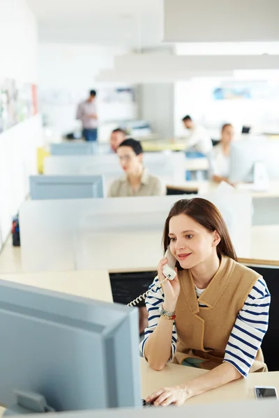 Secretary calling in open-space office — Stock Photo, Image