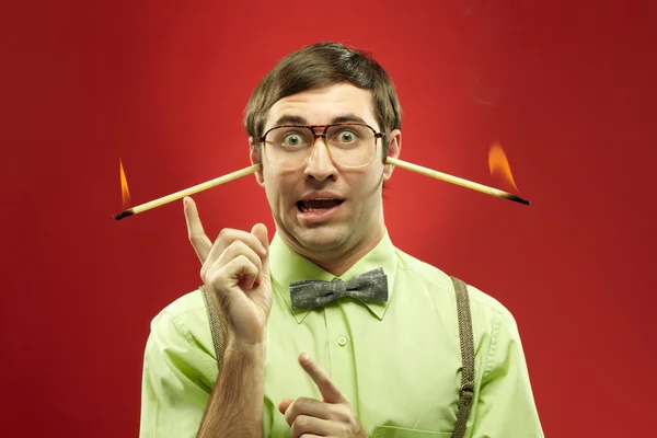 Typical nerd with burning sticks — Stock fotografie
