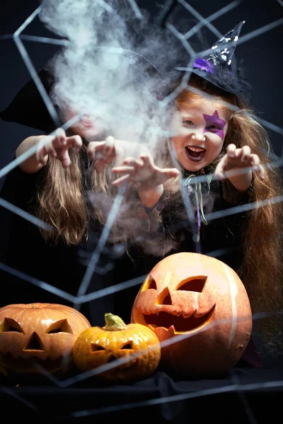 Two witches appearing in smoke — Stock Photo, Image