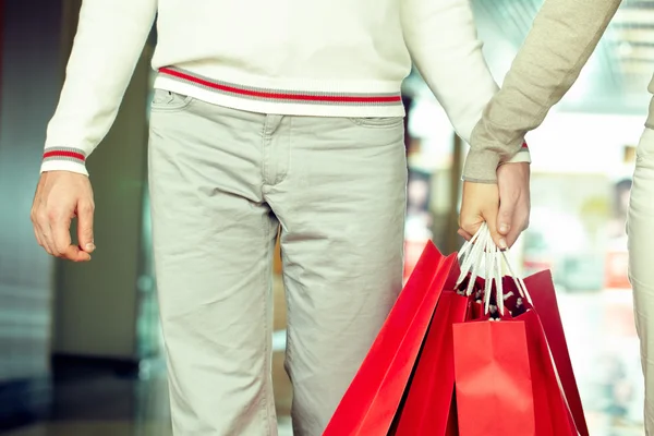 Bunch of paper bags in hands — Stock Photo, Image