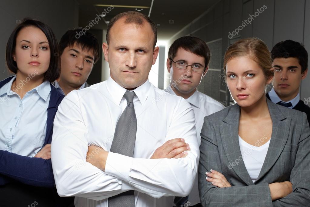Business team standing with arms crossed