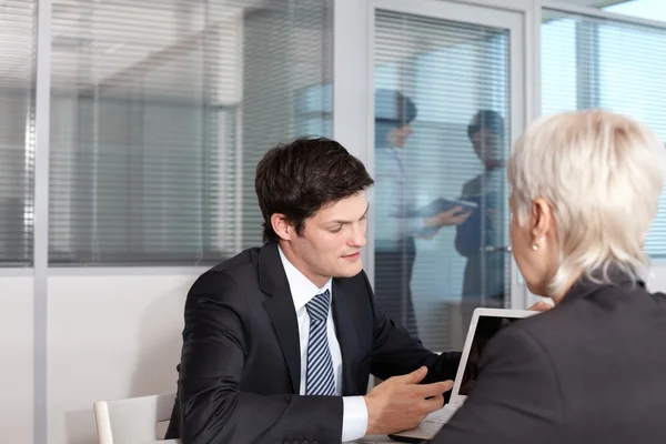 Businessman showing his ideas to female leader — Stock Photo, Image