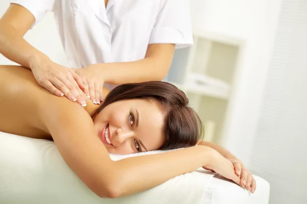 Young woman being massaged at salon — Stock Photo, Image