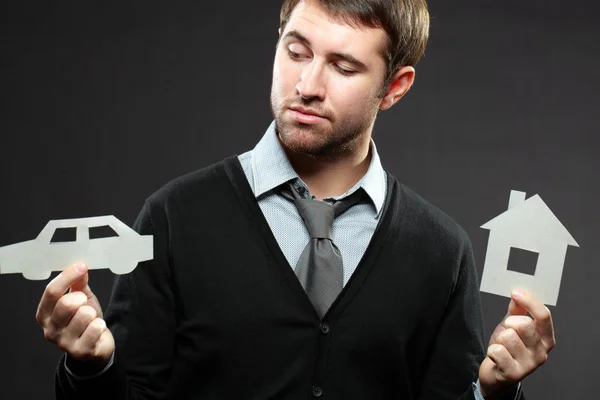 Businessman thinking to buy a car — Stock Photo, Image