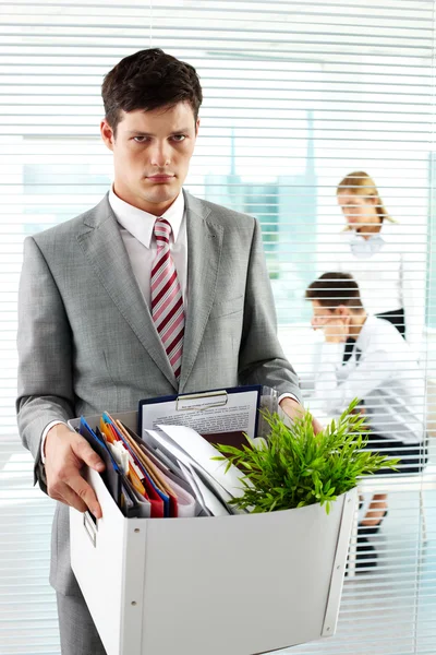 Disappointment businessman with a box full of belongings — Stock Photo, Image
