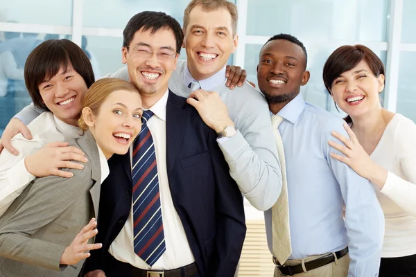 Happy business team looking at camera Stock Image