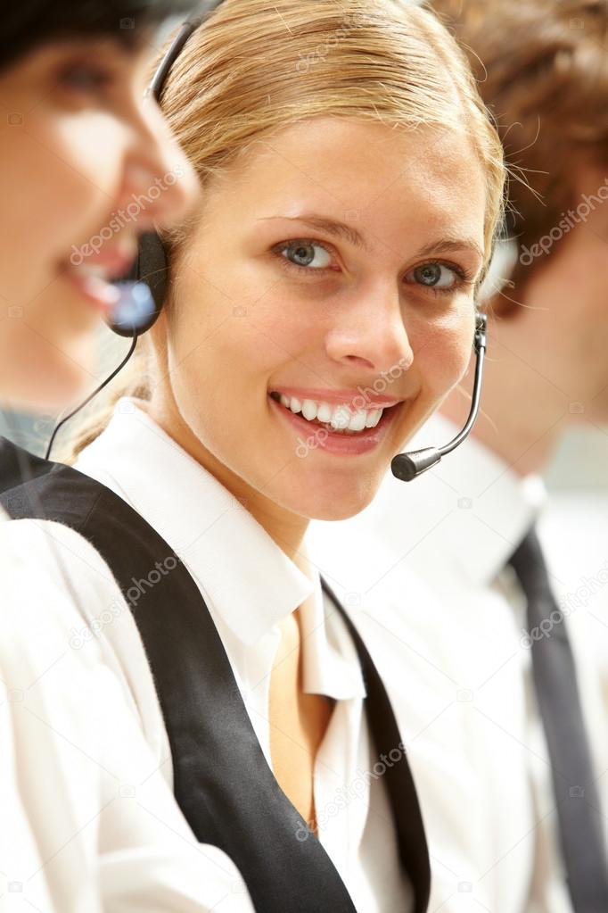 businesswoman in headphones looking at camera 