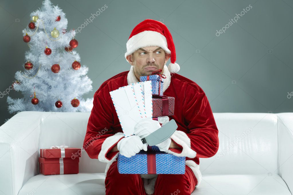 Greedy Santa Claus gripping Christmas presents