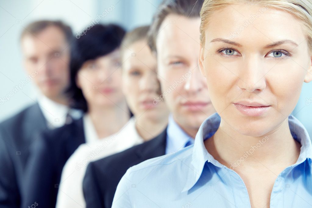 Businesswoman  with her team looking at camera 