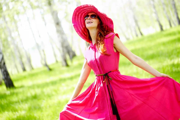 Girl in pink dress and hat — Stock Photo, Image