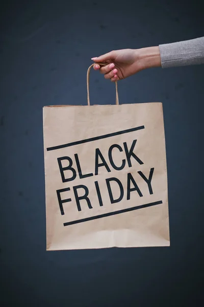 Paper bag held by shopper — Stock Photo, Image
