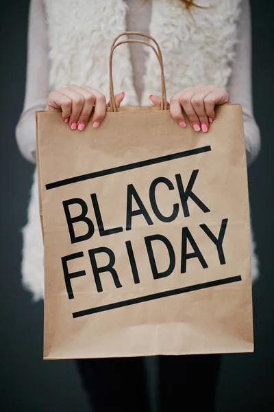 Black Friday purchase in paper bag — Stock Photo, Image