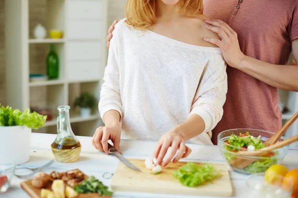 Young couple during preparation of salad — Stock Photo, Image