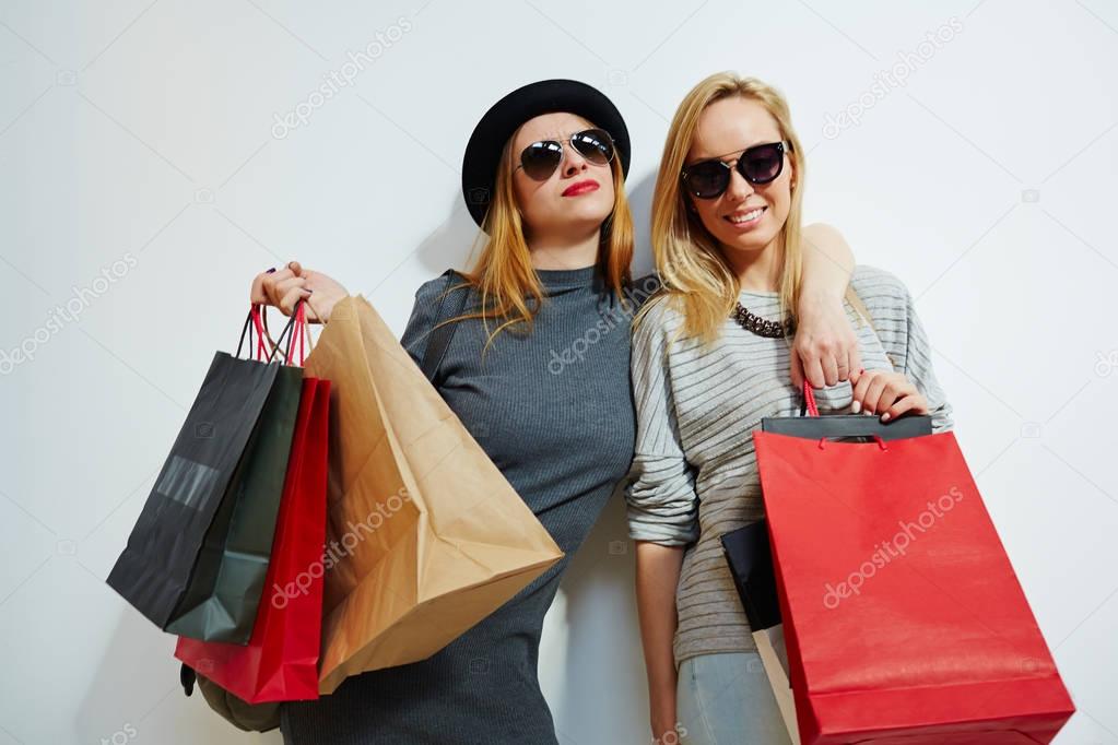 Consumers with paper bags after shopping 