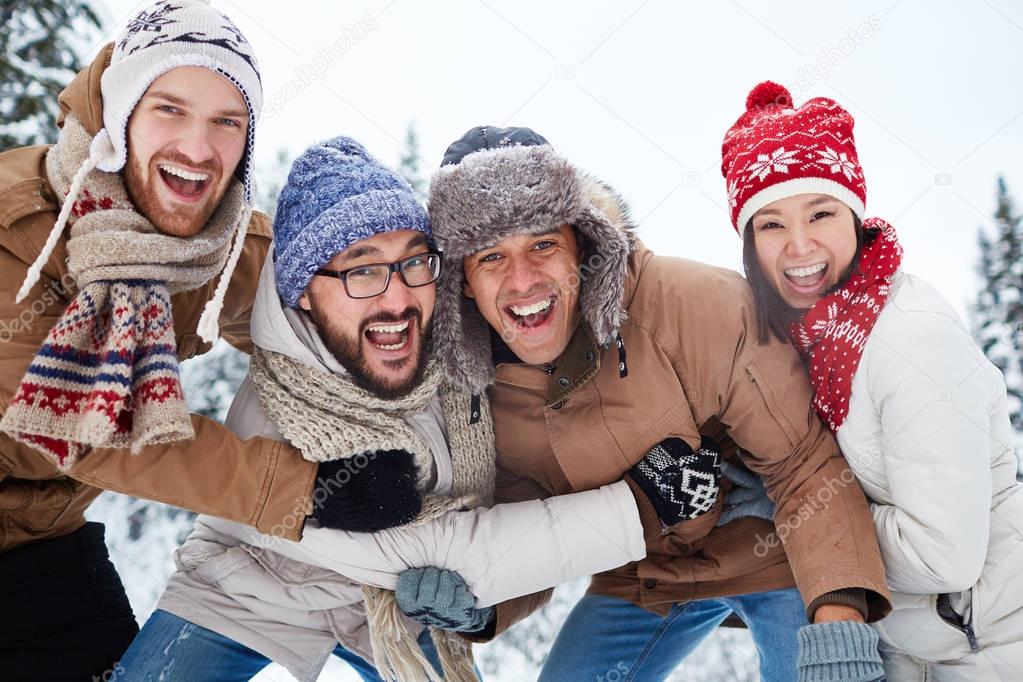 Happy people enjoying winter day