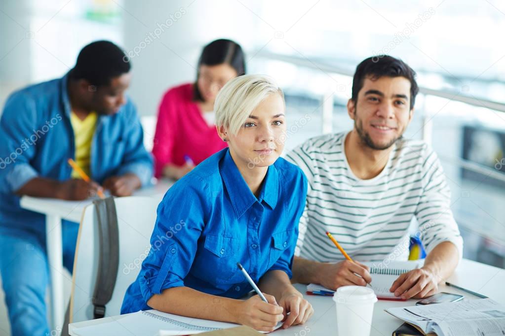 students attending lecture in college  