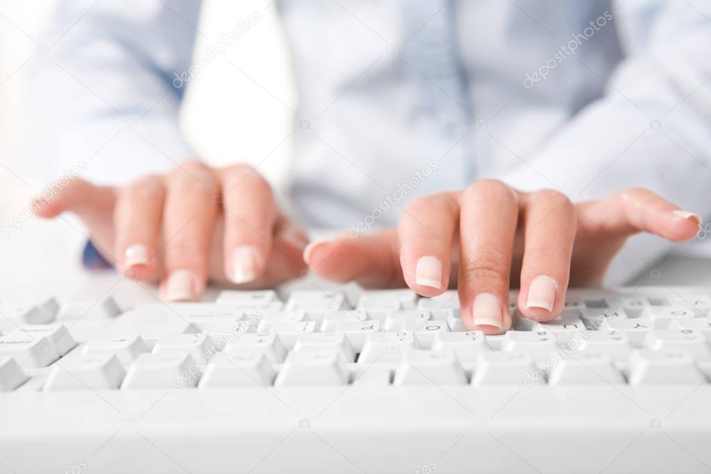 human fingers pushing the buttons of keyboard 