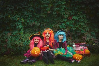 Little girls in Halloween attire  clipart