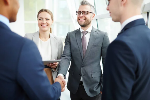 Business partners greeting after signing contract — Stock Photo, Image