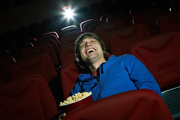 Young man laughing at comedy — Stock Photo, Image