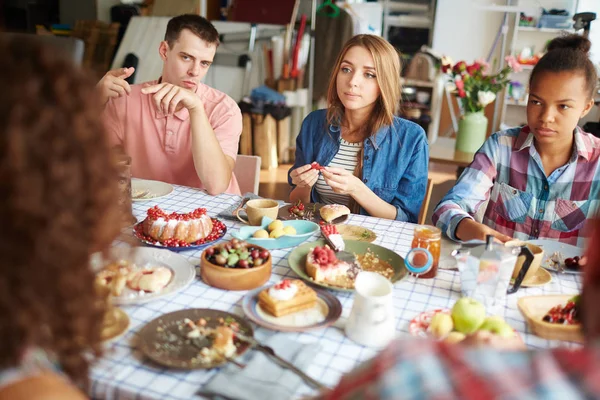 People having conversation by festive dinner — Stock Photo, Image