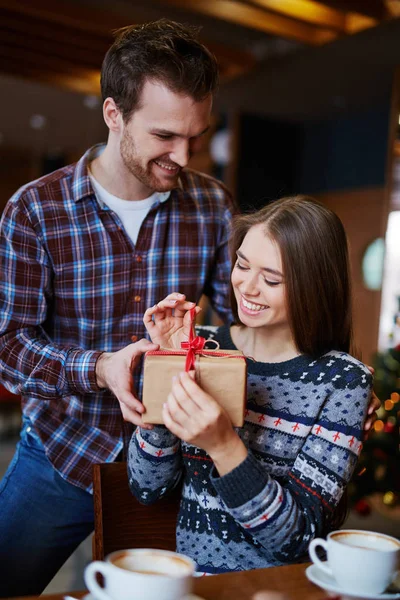 Woman unpacking gift-box — Stock Photo, Image