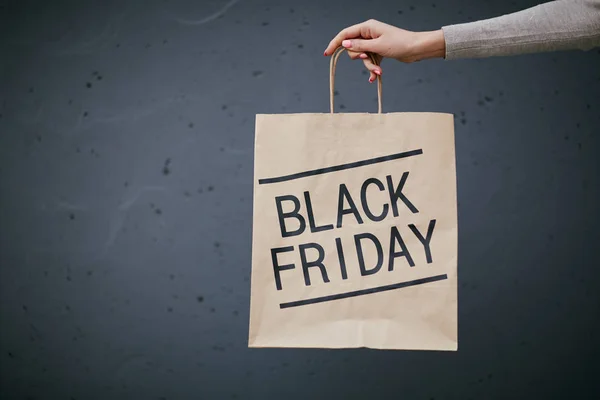 Paper bag with Black Friday purchase — Stock Photo, Image