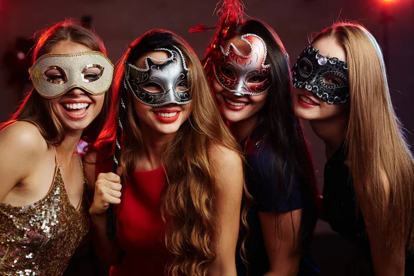 Girls in masquerade masks having party — Stock Photo, Image