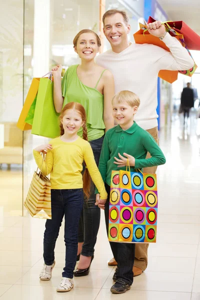 Family walking along a shopping center Stock Image