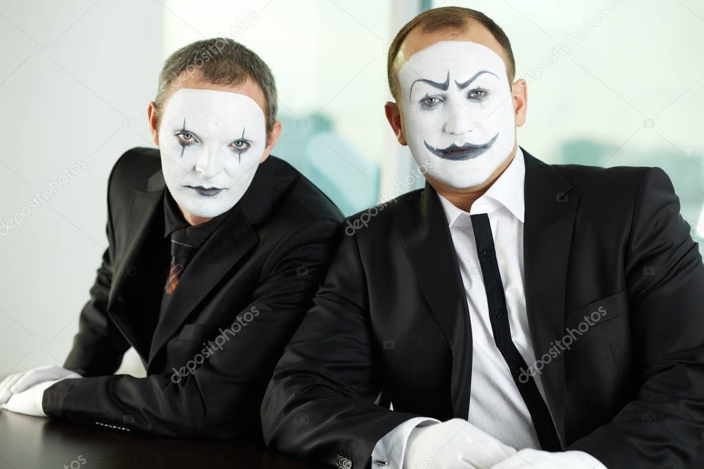 Two mimes representing business people
