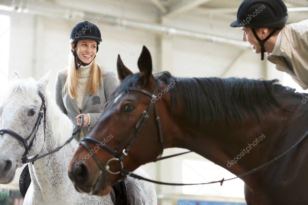 couple enjoying horse training 