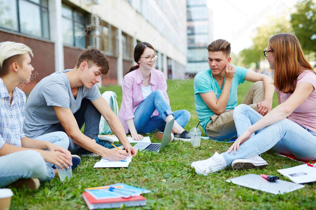 group mates carrying out homework 