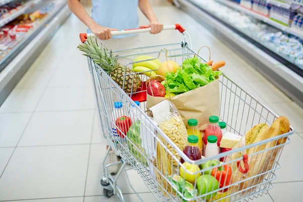 Consumer cart with products — Stock Photo, Image